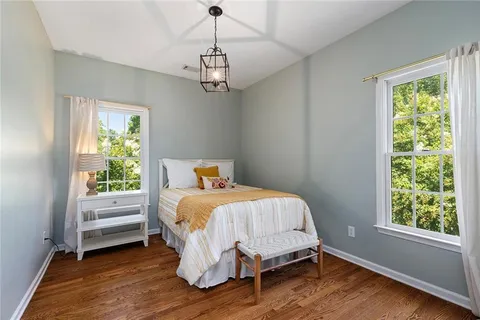 a bedroom with a bed and a table