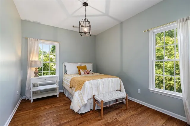 a bedroom with a bed and a table