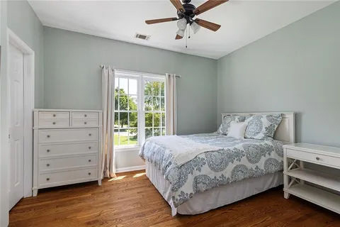 a bathroom with a sink a toilet and shower curtain