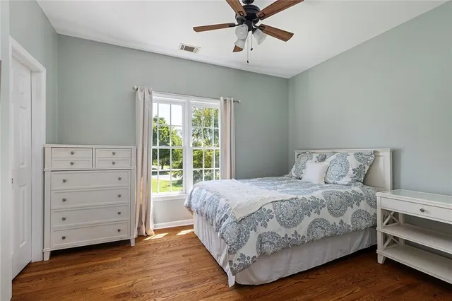 a bathroom with a sink a toilet and shower curtain