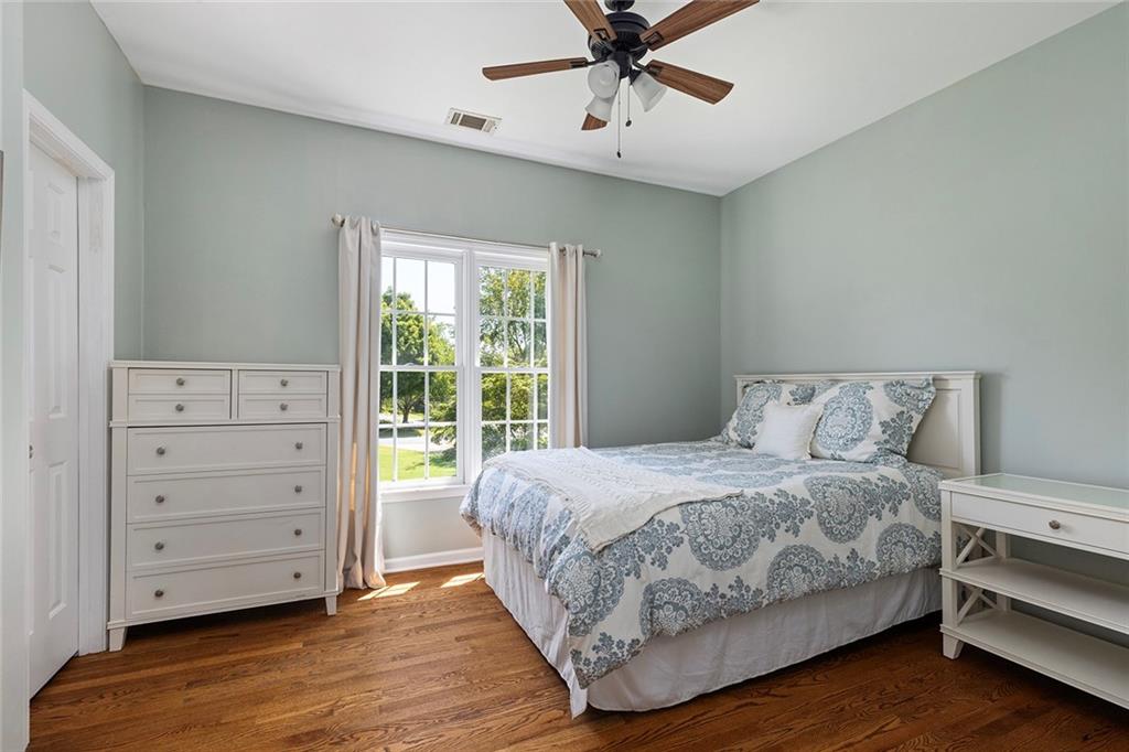 915 Taylor Parkway Suwanee, GA 30024 - Photo 39 of 61 a bedroom with a bed and a window