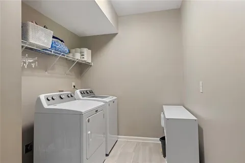 a view of a wooden deck with a yard