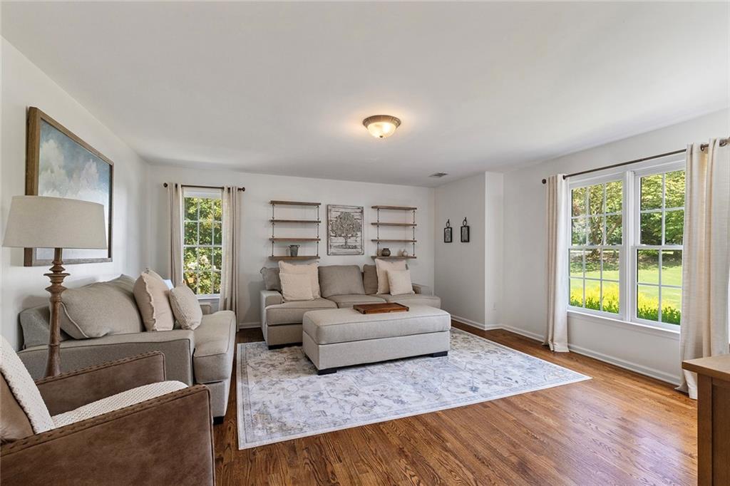 915 Taylor Parkway Suwanee, GA 30024 - Photo 42 of 61 a living room with furniture and a large window