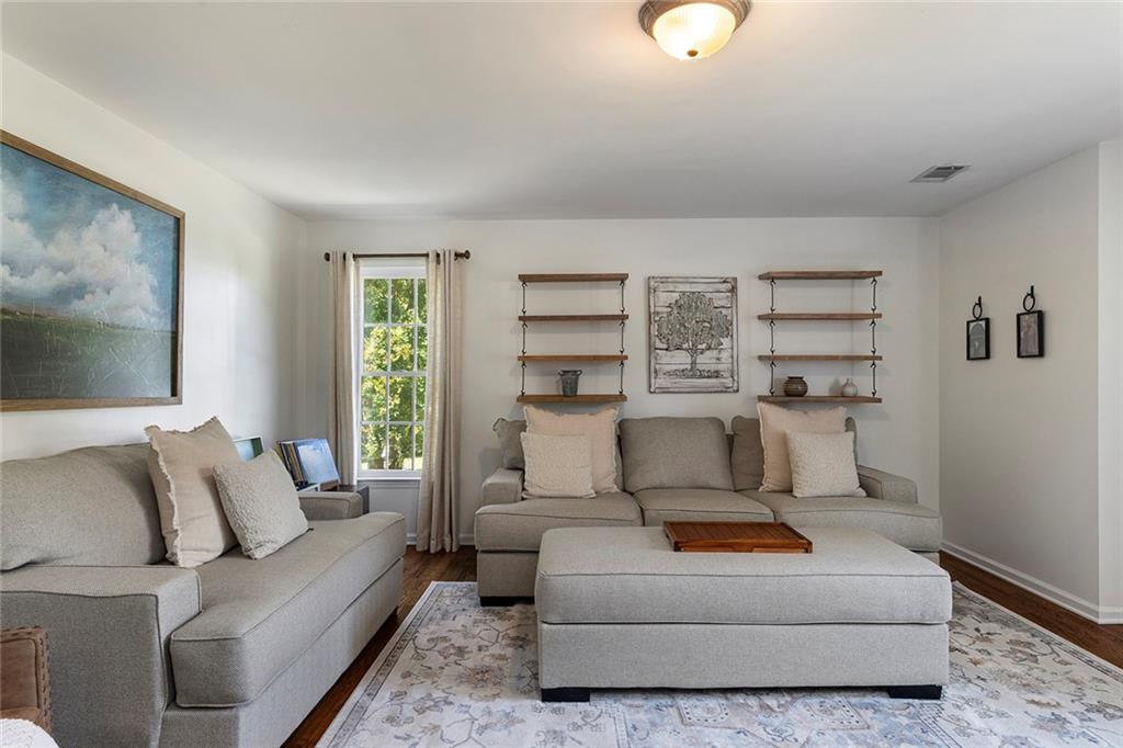 915 Taylor Parkway Suwanee, GA 30024 - Photo 43 of 61 a living room with furniture and a window