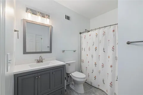 a view of a yard with a large trees