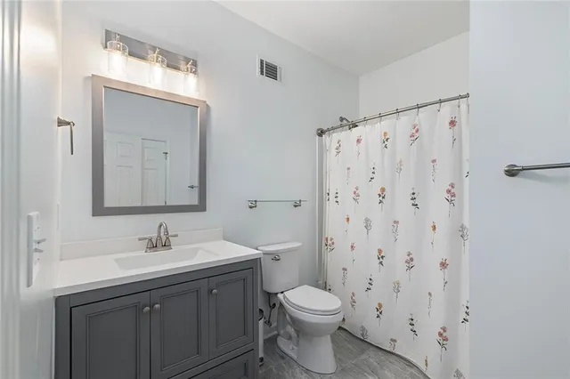 a view of a yard with a large trees