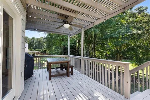 a view of a swimming pool with an outdoor space and seating area