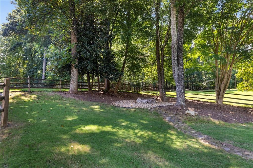 915 Taylor Parkway Suwanee, GA 30024 - Photo 53 of 61 a view of outdoor space with deck and trees