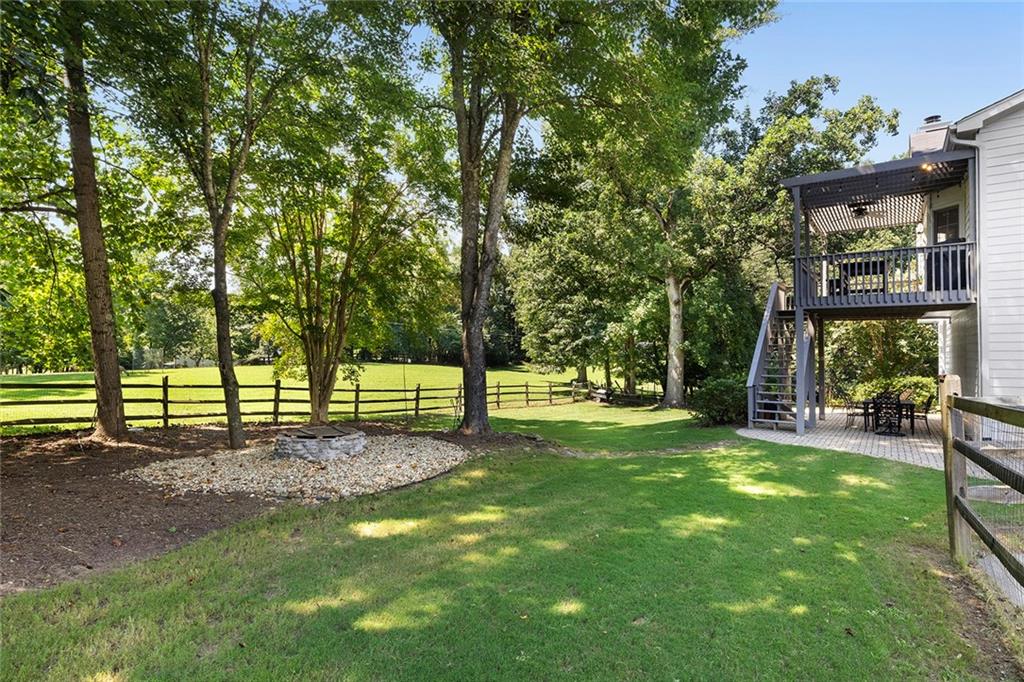 915 Taylor Parkway Suwanee, GA 30024 - Photo 54 of 61 a view of a yard with a tree in the park