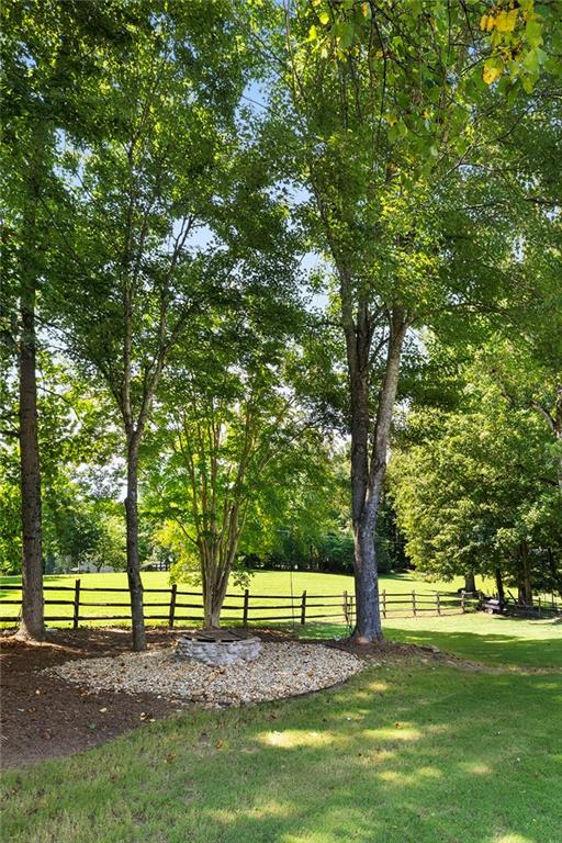 915 Taylor Parkway Suwanee, GA 30024 - Photo 55 of 61 a view of a yard with a large trees