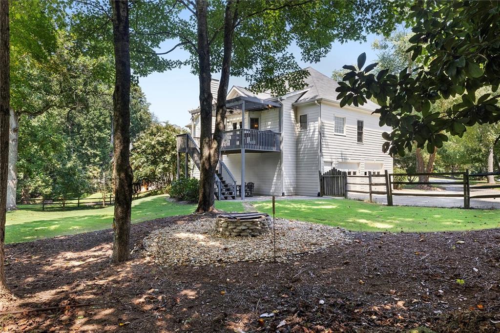 915 Taylor Parkway Suwanee, GA 30024 - Photo 56 of 61 a view of a yard in front of a house with a large tree