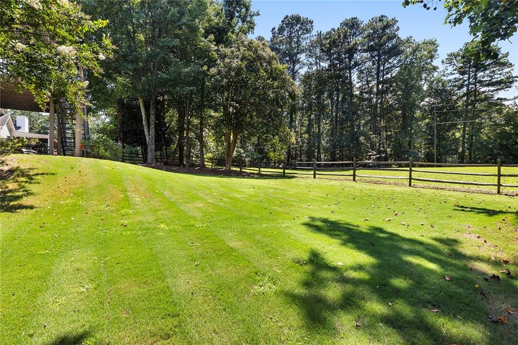 915 Taylor Parkway Suwanee, GA 30024 - Photo 58 of 61 a view of a swimming pool with an outdoor space and seating area