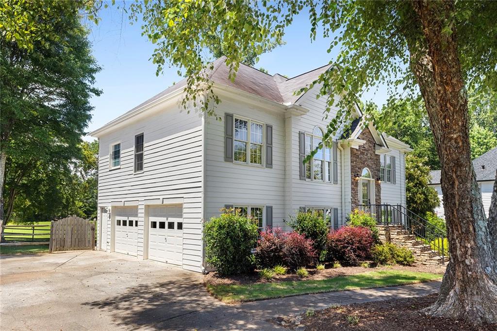 915 Taylor Parkway Suwanee, GA 30024 - Photo 6 of 61 a front view of a house with a yard