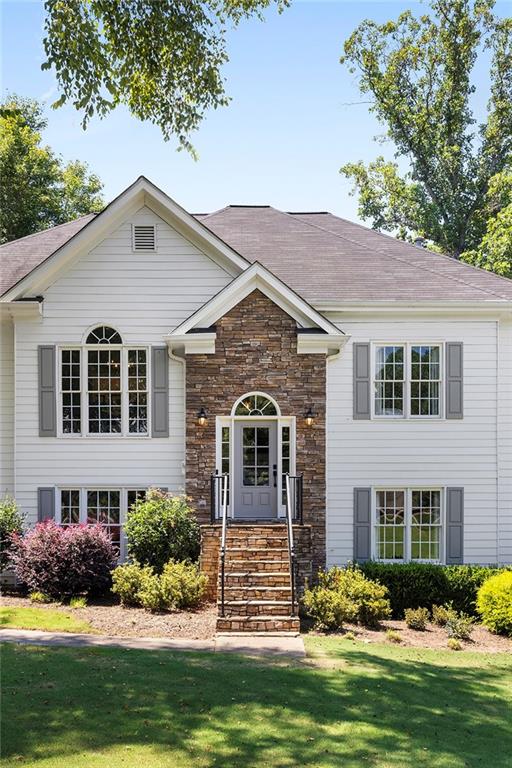 915 Taylor Parkway Suwanee, GA 30024 - Photo 8 of 61 a front view of a house with a yard