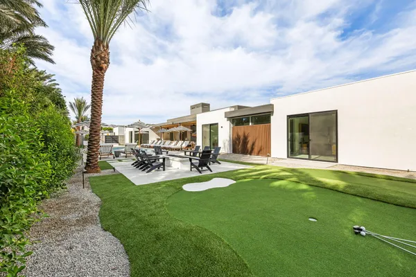 a view of a house with swimming pool yard and patio