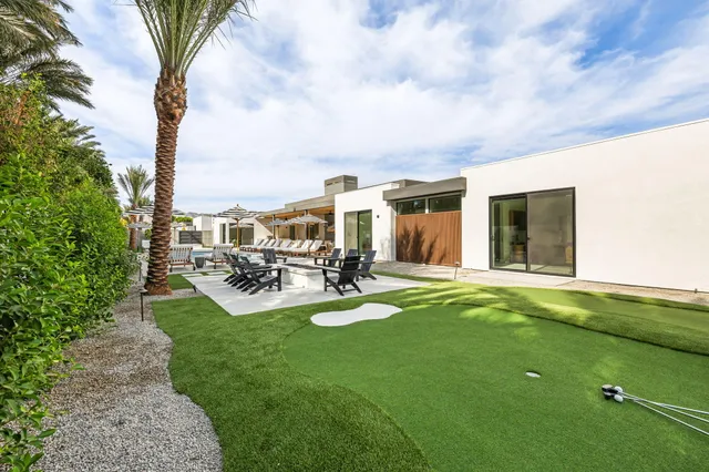 a view of a house with swimming pool yard and patio