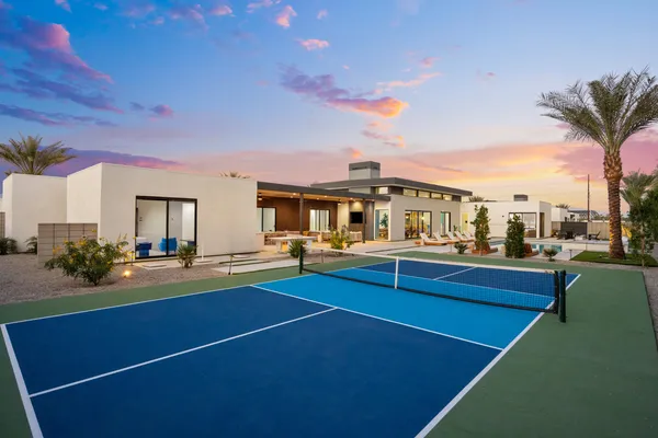 a view of a patio with swimming pool table and chairs