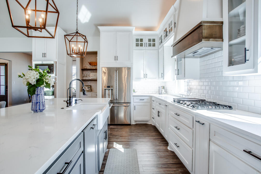 4301 138th Street Lubbock, TX 79423 - Photo 12 of 41 a kitchen with stainless steel appliances granite countertop a lot of counter space and wooden floor