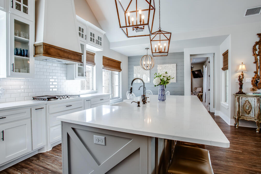 4301 138th Street Lubbock, TX 79423 - Photo 13 of 41 a kitchen with a table chairs and cabinets