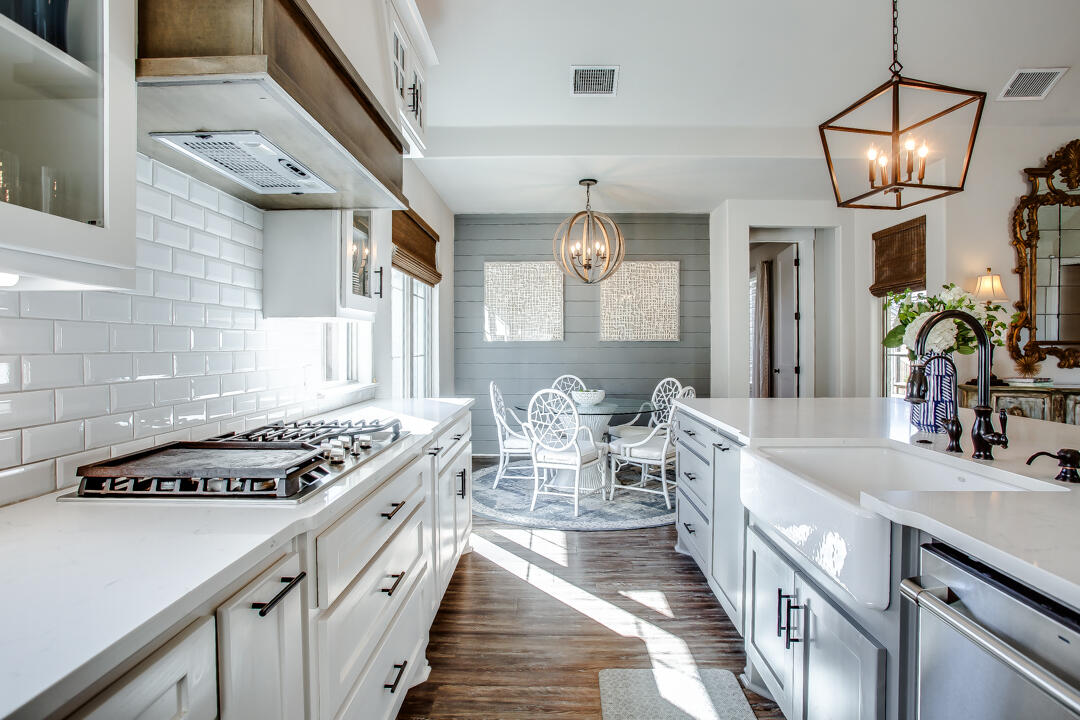 4301 138th Street Lubbock, TX 79423 - Photo 14 of 41 a kitchen with stove a sink and cabinets