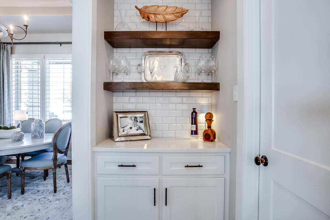 4301 138th Street Lubbock, TX 79423 - Photo 17 of 41 a view of dining room and kitchen with a table chairs and a clock