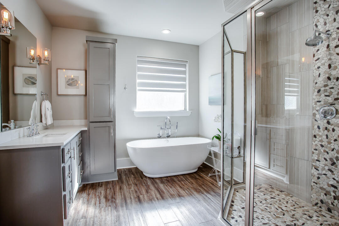 4301 138th Street Lubbock, TX 79423 - Photo 21 of 41 a bathroom with a sink toilet a mirror and shower