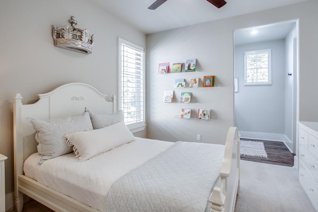 4301 138th Street Lubbock, TX 79423 - Photo 28 of 41 a bedroom with a bed and a couch