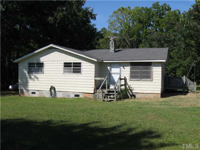 1585 Lettuce Hall Road Spring Hope, NC 27882 - Photo 1 of 11 a front view of a house with garden