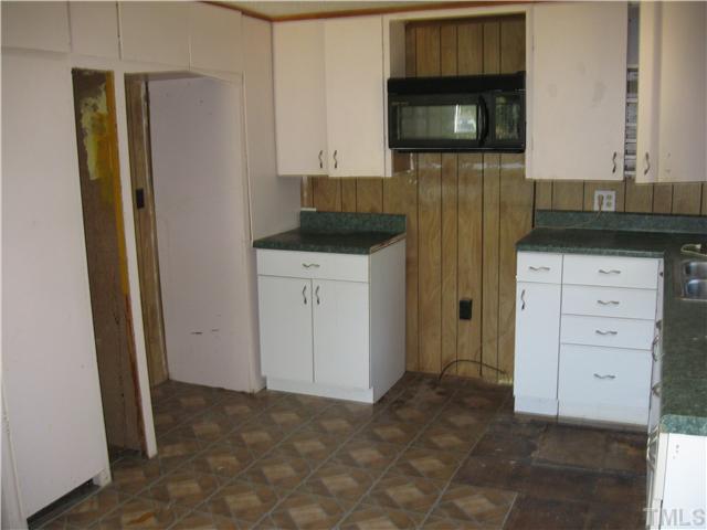 1585 Lettuce Hall Road Spring Hope, NC 27882 - Photo 3 of 11 a kitchen with a refrigerator and a microwave
