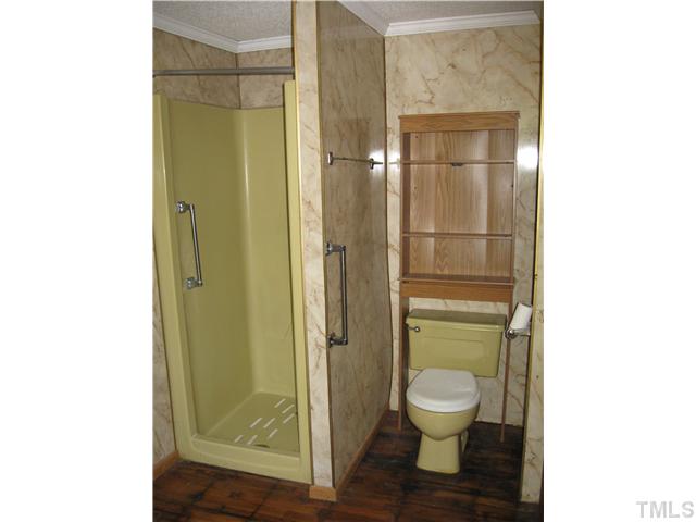 1585 Lettuce Hall Road Spring Hope, NC 27882 - Photo 8 of 11 a bathroom with a toilet shower and a sink