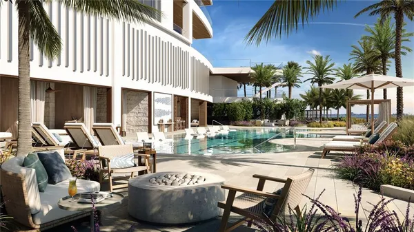a view of a patio with couches and a fire pit