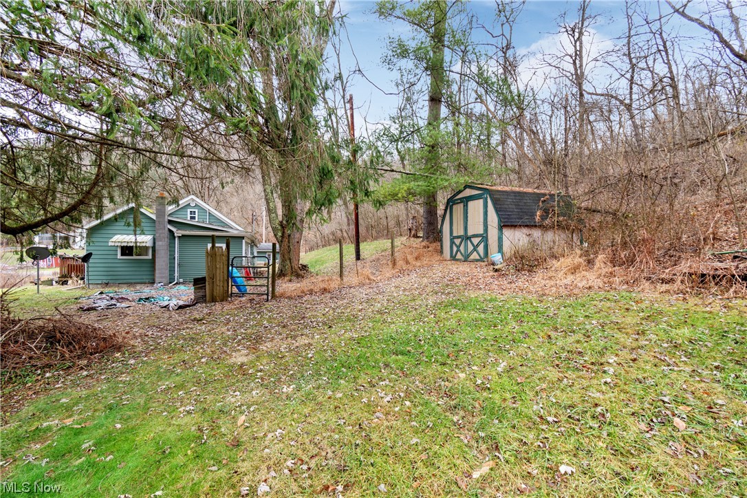 71300 Barton Road Bridgeport, OH 43912 - Photo 23 of 25 View of yard with a storage shed