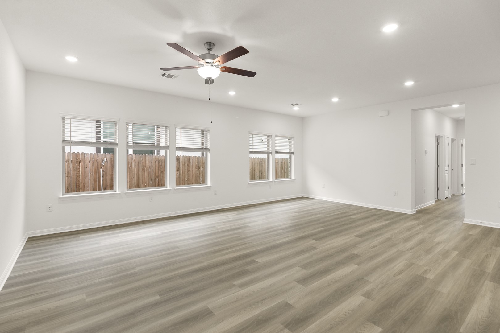 18605 Emu Lane Manor, TX 78653 - Photo 5 of 27 Spacious room featuring light-toned flooring, recessed lighting, and a ceiling fan