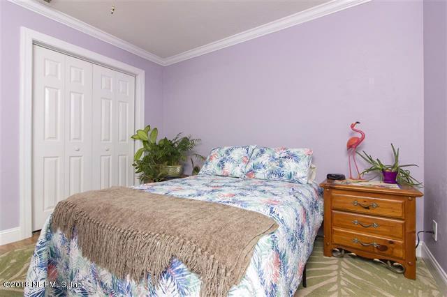 609 Queen Road St. Augustine, FL 32086 - Photo 14 of 35 a bedroom with a bed and a dresser