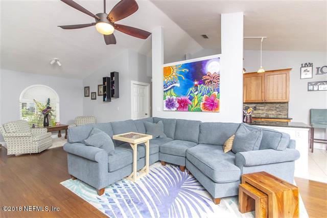 609 Queen Road St. Augustine, FL 32086 - Photo 2 of 35 a living room with furniture ceiling fan and a rug