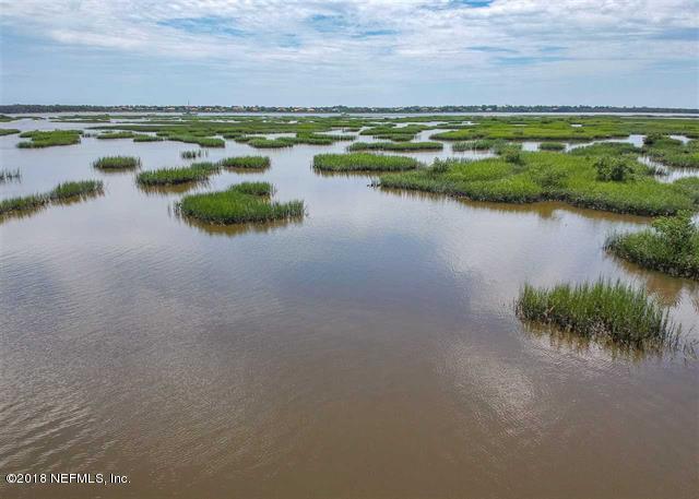 609 Queen Road St. Augustine, FL 32086 - Photo 25 of 35 a view of a lake with a city view