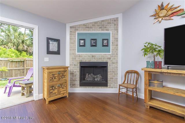 609 Queen Road St. Augustine, FL 32086 - Photo 4 of 35 a living room with furniture and a fireplace