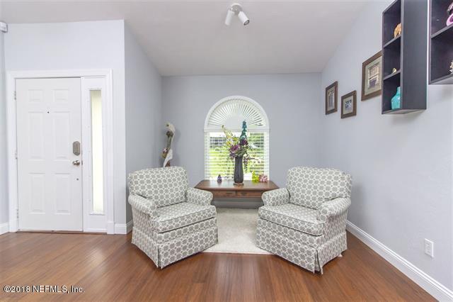 609 Queen Road St. Augustine, FL 32086 - Photo 5 of 35 a living room with furniture and a large window