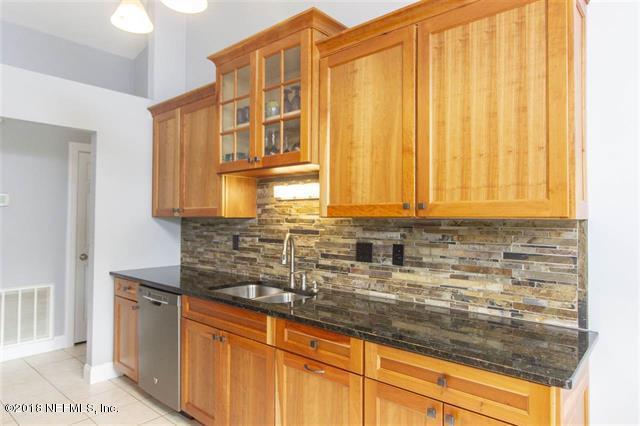 609 Queen Road St. Augustine, FL 32086 - Photo 7 of 35 a kitchen with stainless steel appliances granite countertop white cabinets and a granite counter tops