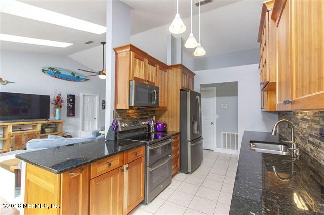 609 Queen Road St. Augustine, FL 32086 - Photo 8 of 35 a kitchen with granite countertop a sink appliances and cabinets