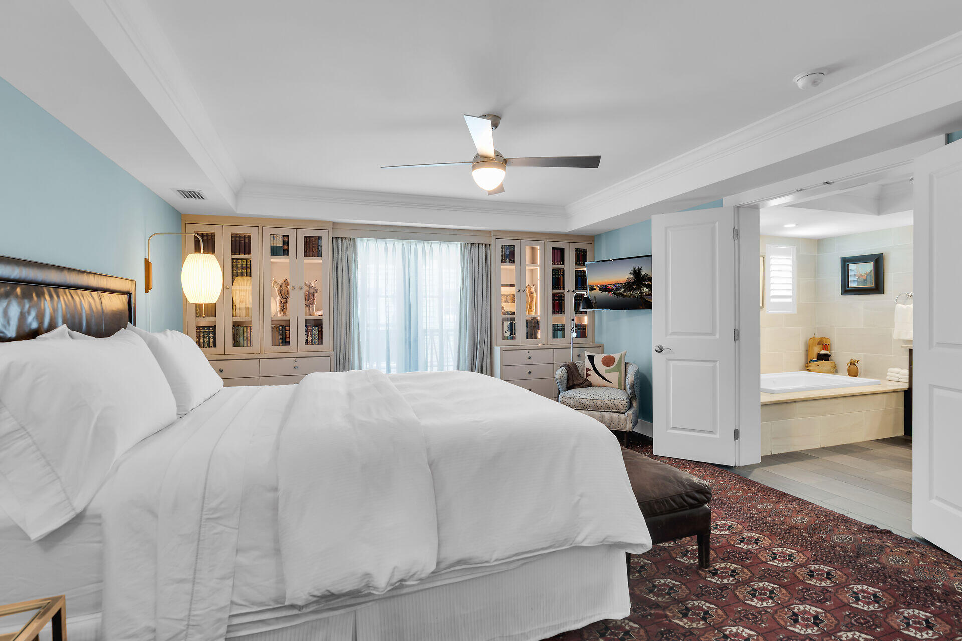 141 Simonton Street Key West, FL 33040 - Photo 24 of 49 a bedroom with a large bed and a view of kitchen