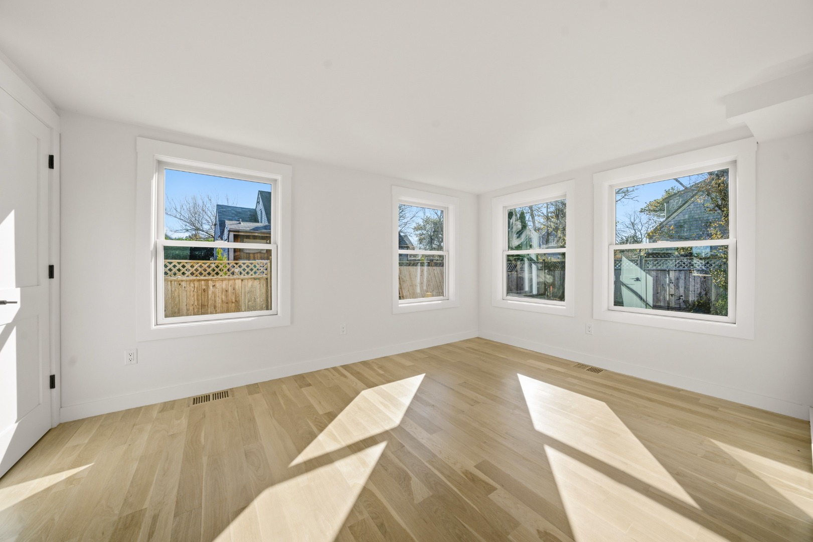 38 Hooper Farm Road Nantucket, MA 02554 - Photo 12 of 19 a view of a bedroom with wooden floor and windows