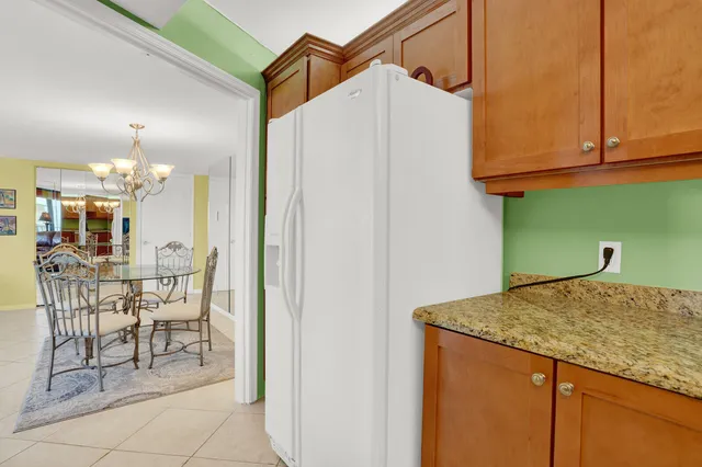 a view of a kitchen and dining table