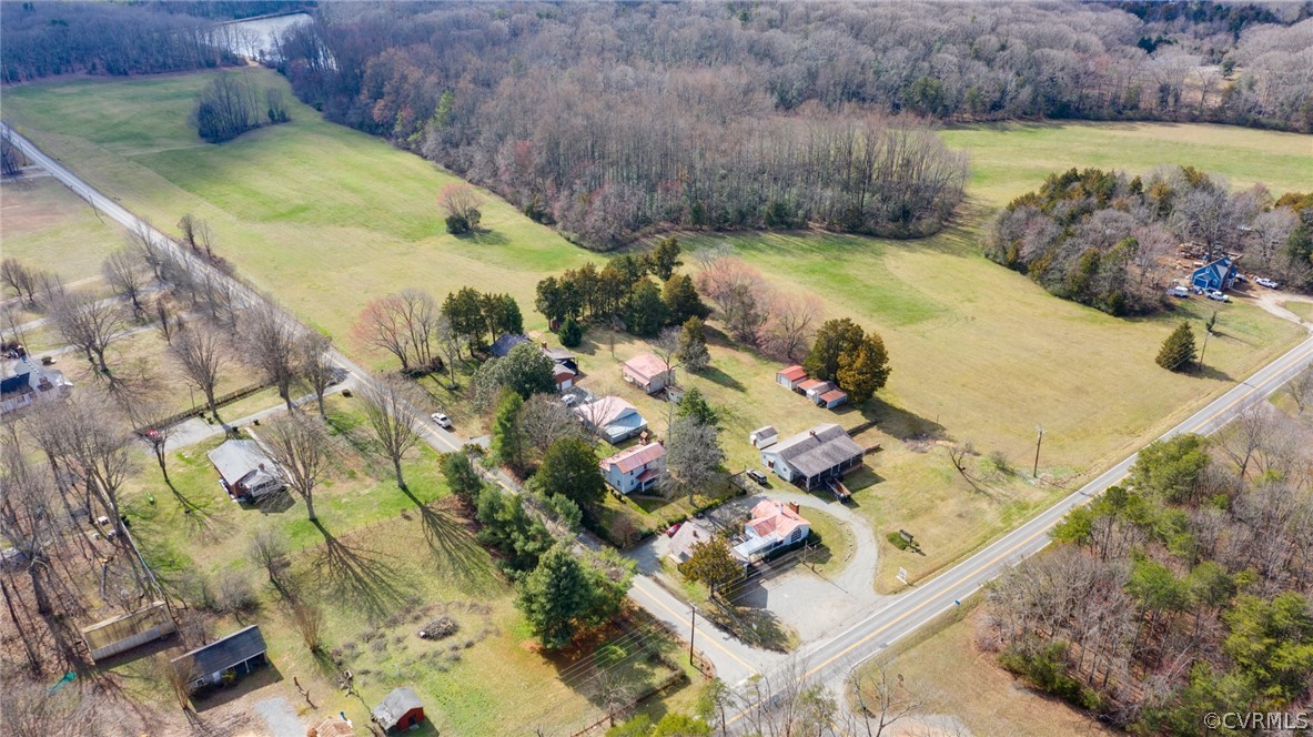 1037 Broad St Road Manakin-Sabot, VA 23103 - Photo 1 of 50 a view of a swimming pool with a yard