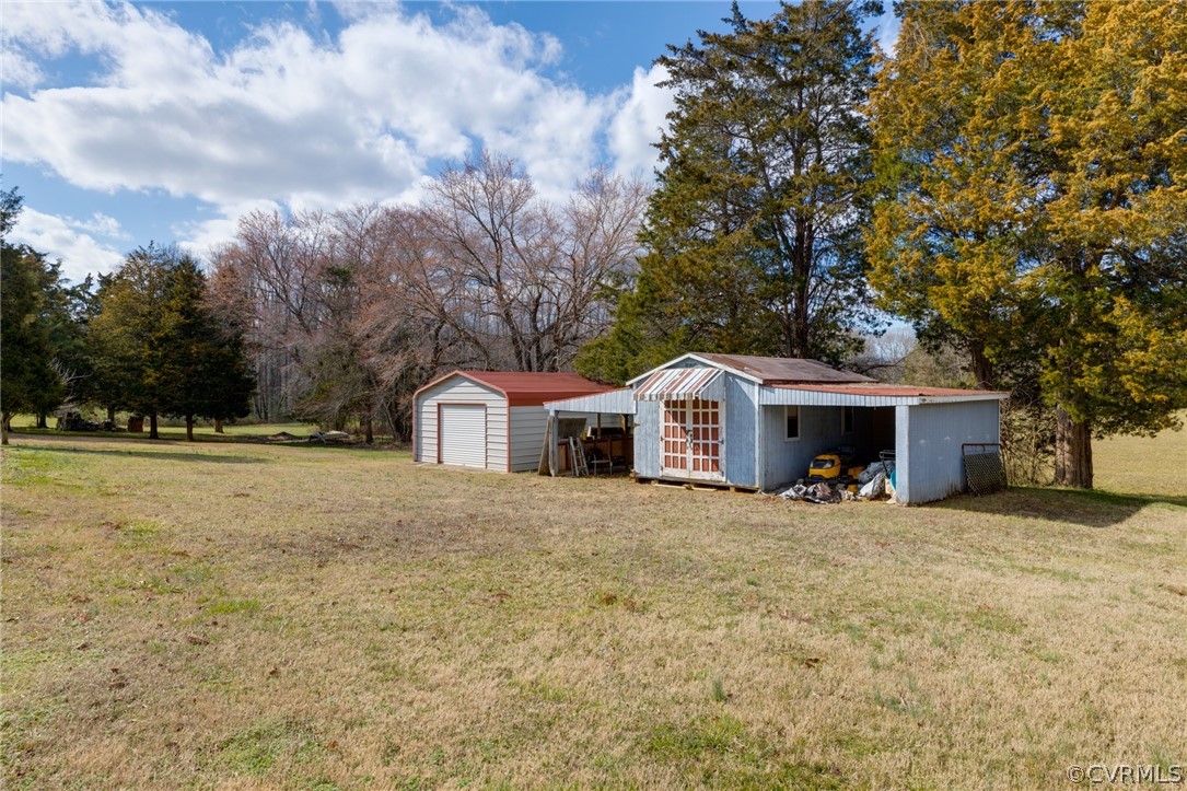 1037 Broad St Road Manakin-Sabot, VA 23103 - Photo 14 of 50 a front view of a house with a yard