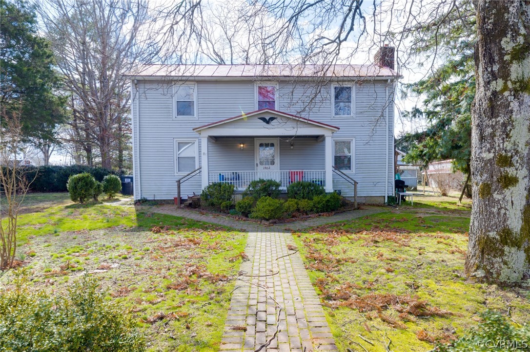 1037 Broad St Road Manakin-Sabot, VA 23103 - Photo 2 of 50 a front view of a house with garden