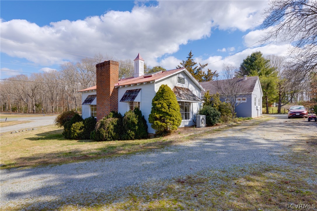 1037 Broad St Road Manakin-Sabot, VA 23103 - Photo 21 of 50 a front view of a house with a yard
