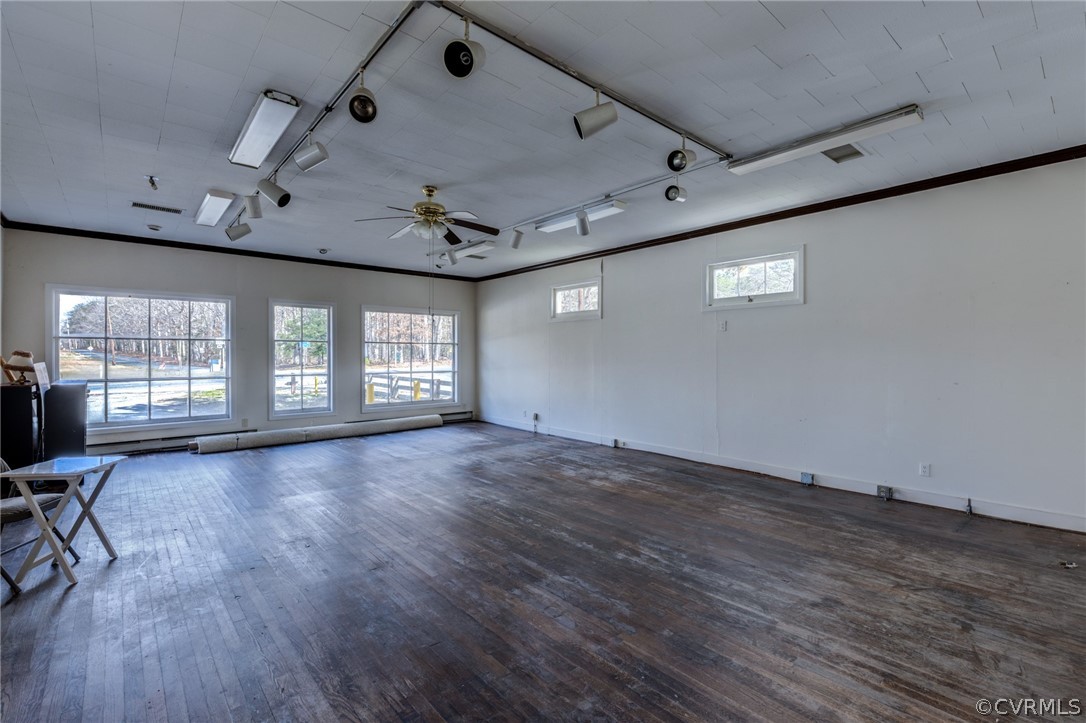 1037 Broad St Road Manakin-Sabot, VA 23103 - Photo 25 of 50 an empty room with wooden floor and windows