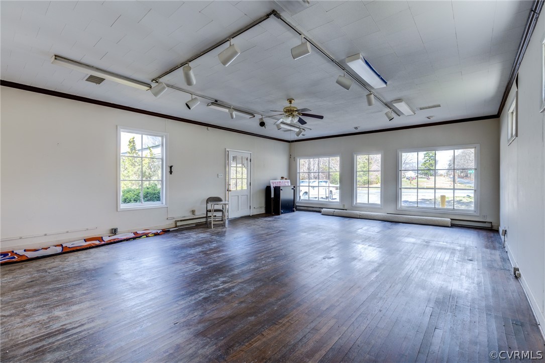 1037 Broad St Road Manakin-Sabot, VA 23103 - Photo 26 of 50 an empty room with wooden floor and windows