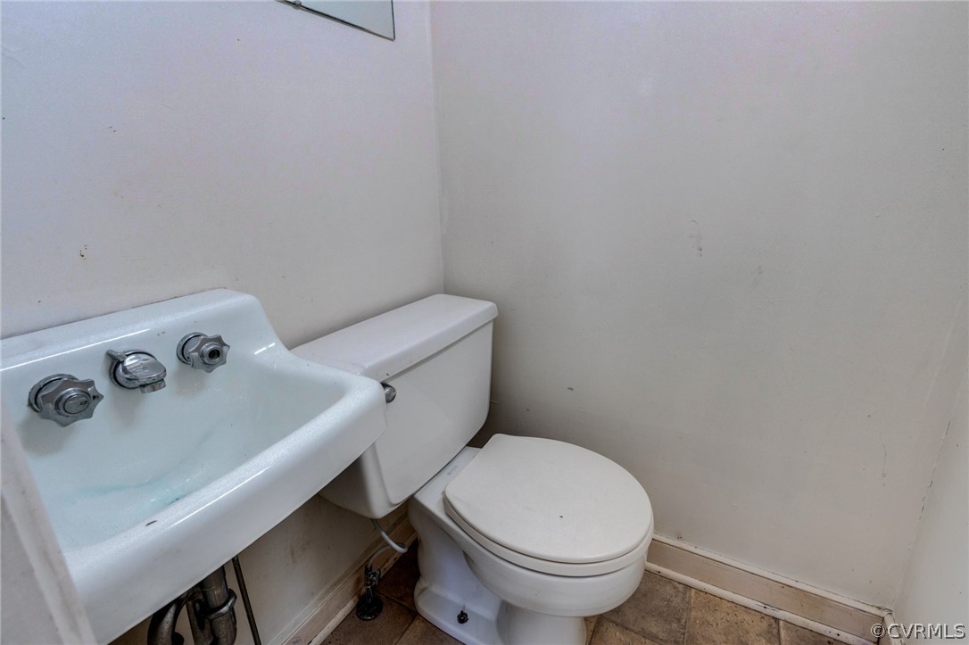 1037 Broad St Road Manakin-Sabot, VA 23103 - Photo 36 of 50 a white toilet sitting next to a white sink